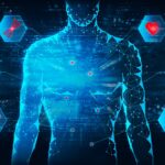 Digital image of male upper body in blue holographic imagery. Signs extended from the body with red icons showing health symbols. Black background.